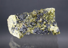 Load image into Gallery viewer, Fassaite, Vesuvianite, and Spinel on Matrix
