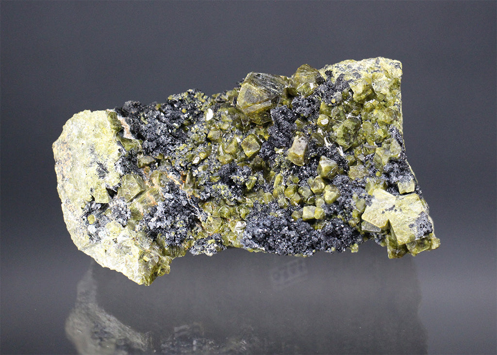 Fassaite, Vesuvianite, and Spinel on Matrix